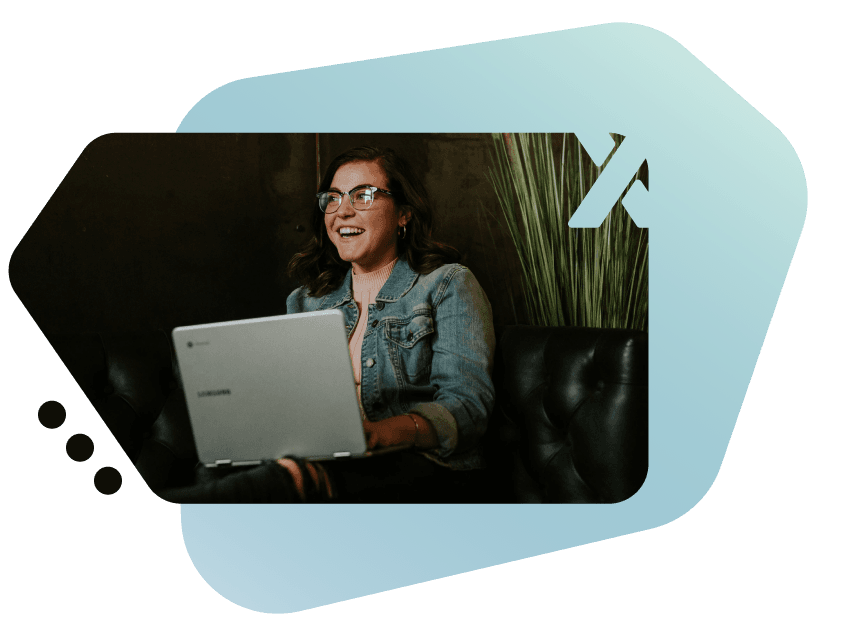 Person using a laptop with Xloud brand graphic